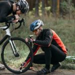 Man Fixing Bicycle of His Friend